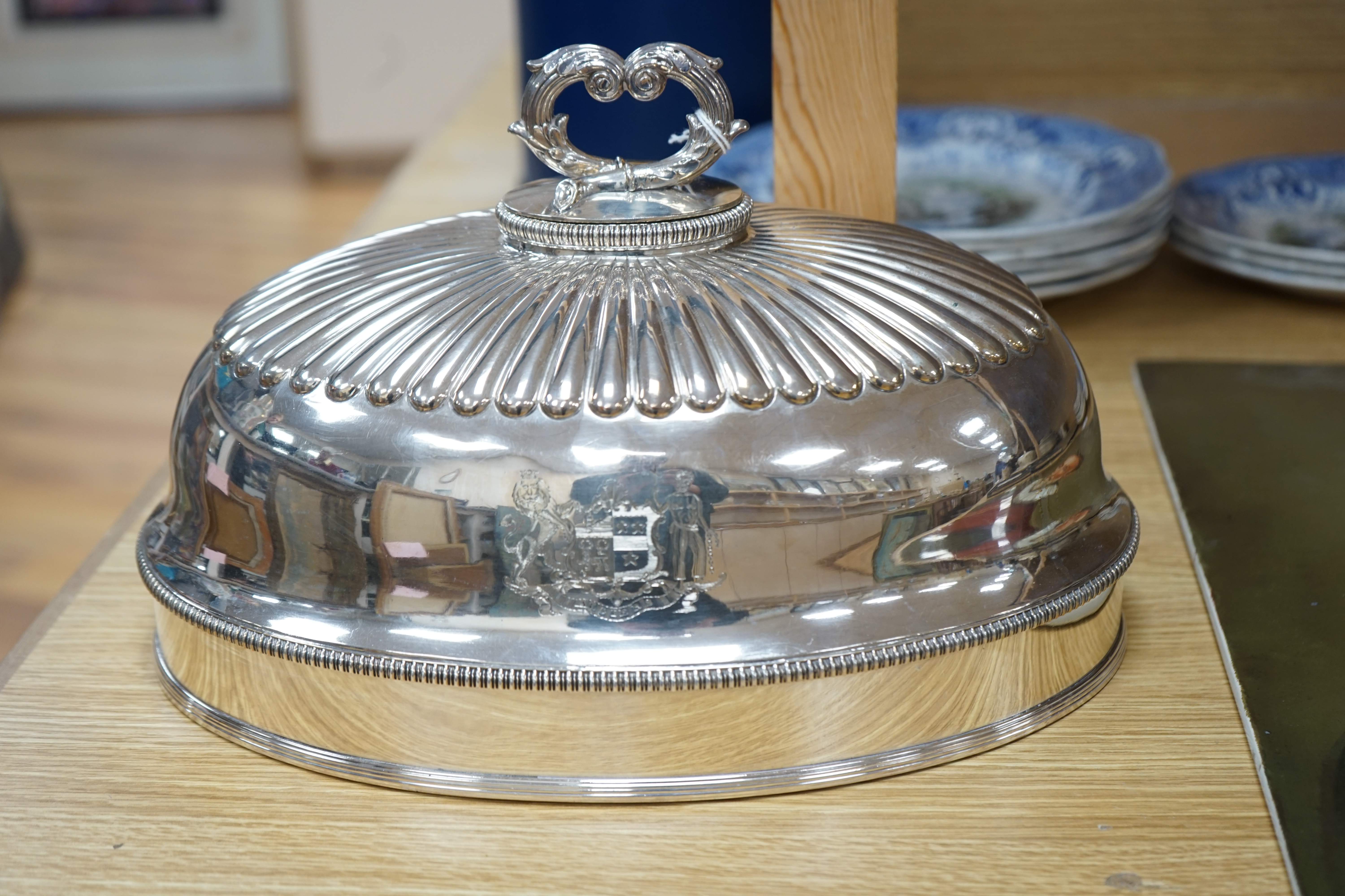 A 19th century Old Sheffield plate oval meat dish cover, with handle, 32.5cm long. Condition - good